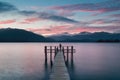 Woman Silhouette in Romantic wharf on Te Anau on South Island of New Zealand Beautiful pier on sunrise. Lake Te Anau.