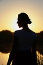 Woman silhouette on the side at sunset Royalty Free Stock Photo