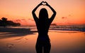 Woman, silhouette and sunset by water with heart hands for love, care and kindness with sign, summer and body. Girl Royalty Free Stock Photo