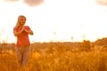 Woman silhouette waiting for summer sun on meadow Royalty Free Stock Photo