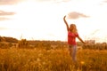 Woman silhouette waiting for summer sun on meadow Royalty Free Stock Photo