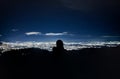 Woman silhouette watching bogota cityscape at night from a mountain Royalty Free Stock Photo