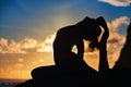Woman silhouette in yoga pose on sunset sea beach Royalty Free Stock Photo