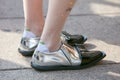 Woman with silver and black leather shoes before Gabriele Colangelo fashion show, Milan Fashion Week street