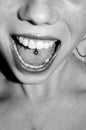 Woman with silver tongue piercing