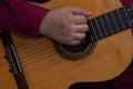 Woman, singing guitarist modeling with her guitar