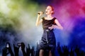 Woman singing for her fans on a concert Royalty Free Stock Photo