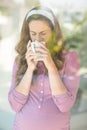 Woman sipping coffee from cup Royalty Free Stock Photo