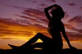 Woman sit cowgirl sunset Royalty Free Stock Photo