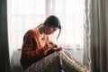 woman sit Depression Dark haired pensive glance Standing by window and anxiety Copy space Royalty Free Stock Photo