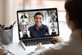 Indian lady lead videocall, pc screen view over woman shoulder Royalty Free Stock Photo