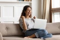 Woman reading great news on laptop feels excited and happy