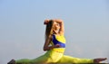 Woman sit in split. flexible girl in sportswear. Young attractive woman practicing yoga. Splits exercise. leg muscles