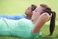 Woman, sit ups and workout on green grass for fitness or outdoor exercise together in nature. Young active female person Royalty Free Stock Photo