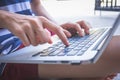 Woman sit using laptop hand on keyboard. vintage effect.