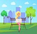 Woman Sits on Bench in City Park with Laptop Royalty Free Stock Photo