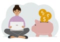 A woman sits cross-legged with a laptop next to a pig piggy bank. Earning money, saving, saving money. Royalty Free Stock Photo