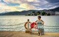 The woman sitting by the lake