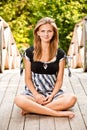 Woman sits in lotus pose