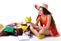 Woman sits near filled suitcase. Royalty Free Stock Photo