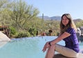 A Woman Sits Poolside in Arizona`s Sonoran Desert Royalty Free Stock Photo