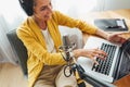 Female podcaster streaming her voice into microphone Royalty Free Stock Photo