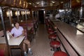 A woman sits in a replica of the 1950`s diner