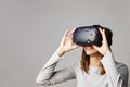 Woman Sits On Sofa At Home Wearing Virtual Reality Headset Royalty Free Stock Photo