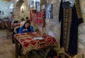 Woman sits at the table and drinks coffee in a roadside restaurant near the city of Wadi Musa in Jordan