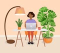 Woman sits at a table, works at home at a computer. Remote work, freelance, home office, programming, training. Interior
