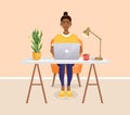 Woman sits at a table, works at home at a computer. Remote work, freelance, home office, programming, training. Cozy Royalty Free Stock Photo