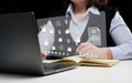 Woman sits at a table and works with a laptop. Document management mystem DMS. Software for automating archiving and efficient m