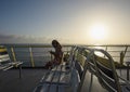 Woman sitting aboard a ferry with covid mask