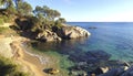 Woman sitting alone on quiet beach in Spain