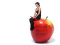 Woman Sitting on an Apple Royalty Free Stock Photo