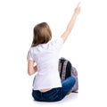 Woman sitting with backpack showing Royalty Free Stock Photo