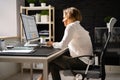 Woman Sitting In Bad Posture Working On Computer Royalty Free Stock Photo