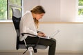 Woman Sitting In Bad Posture Working On Computer Royalty Free Stock Photo