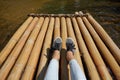 Woman sitting on the bamboo raft floating in clear water Royalty Free Stock Photo