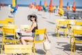 Woman sitting on the beach in Deauville, France Royalty Free Stock Photo