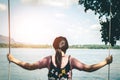 Woman sitting beach swings in nature. Royalty Free Stock Photo