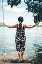 Woman sitting beach swings in nature. Royalty Free Stock Photo