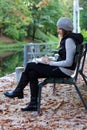 Woman sitting on a bench with her Laptop