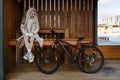 Woman Sitting on Bench Next to Bike