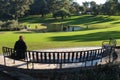 Woman sitting on the bench at the park