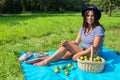 Woman sitting on blanket with pears in orchard Royalty Free Stock Photo