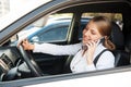 Woman sitting in the car and talking on the phone Royalty Free Stock Photo