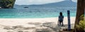 Woman sitting on chair on beach