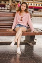 Woman sitting in a chair in a train station Royalty Free Stock Photo