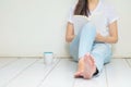 Woman sitting at the corner of house for reading a book in free time in the afternoon , relax time of asian woman Royalty Free Stock Photo